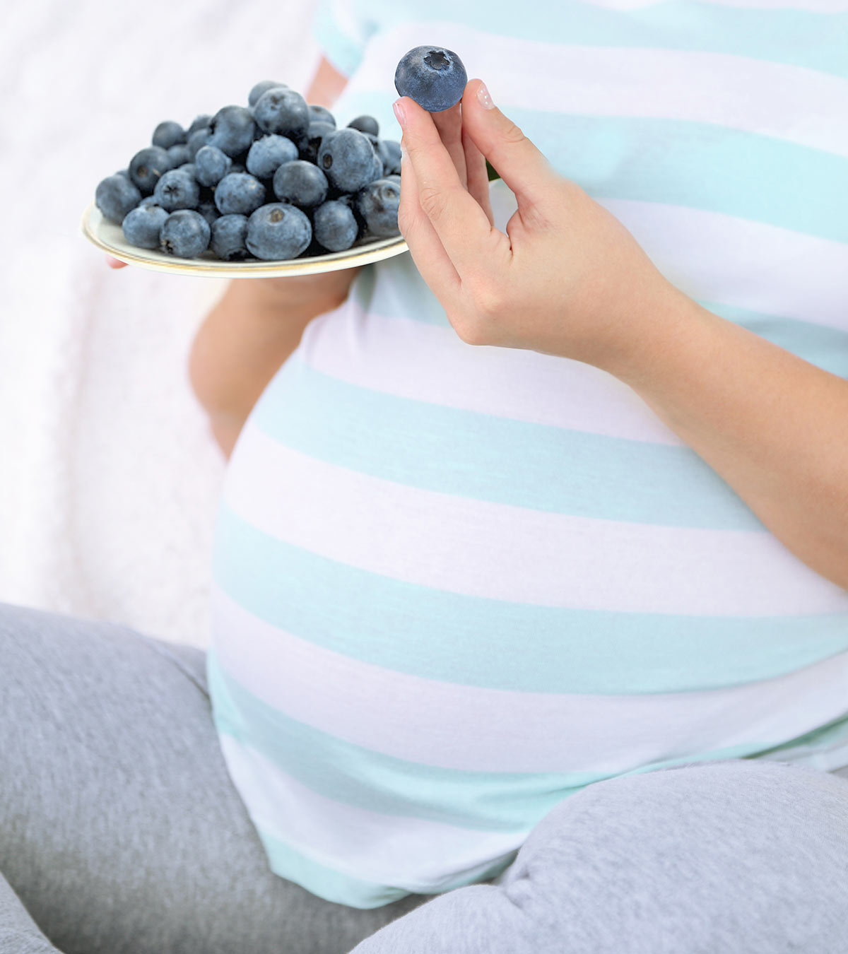 Pregnant Woman Eating Blueberries