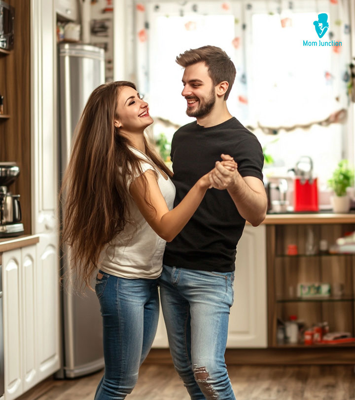 A Couple Dancing At Home