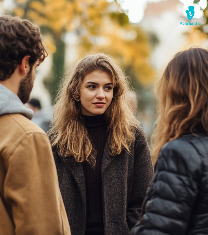 Man Playfully Interacting With Another Girl Making His Girlfriend Feel Jealous